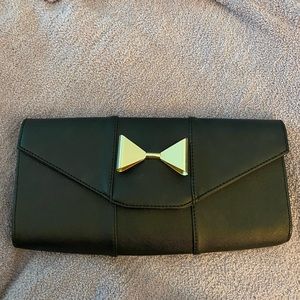 Black Clutch with Gold Bow and Gold Chain Strap